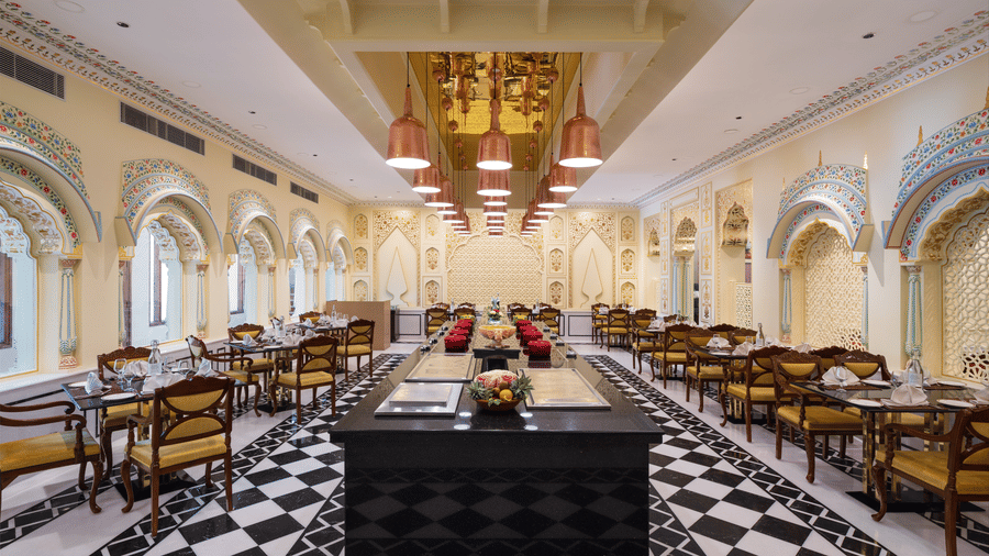 An image of the Suvarna Mahal with tables and a center piece - heritage village resorts & spa, Manesar