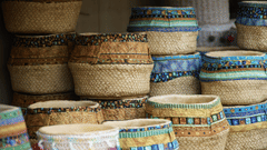A close up of many wicker baskets kept on top of each other to be sold in Broadway Market, Kochi.