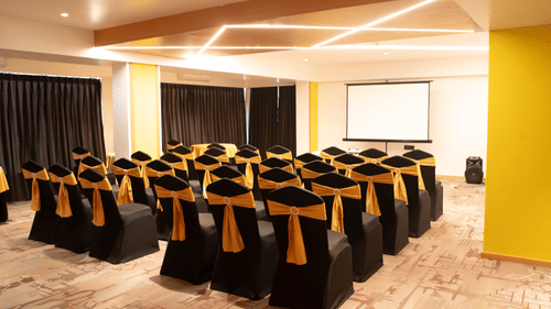 Event space at Magnus Lxia Premier, Kalyani Nagar designed for conferences and gatherings with elegant seating.