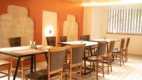 Restaurant seating at Magnus Lxia Premier, Kalyani Nagar with modern décor and comfortable dining setup.