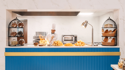 A live interactive counter at our restaurant in Haridwar where the chef is preparing food - MJ Sarovar Portico, Haridwar