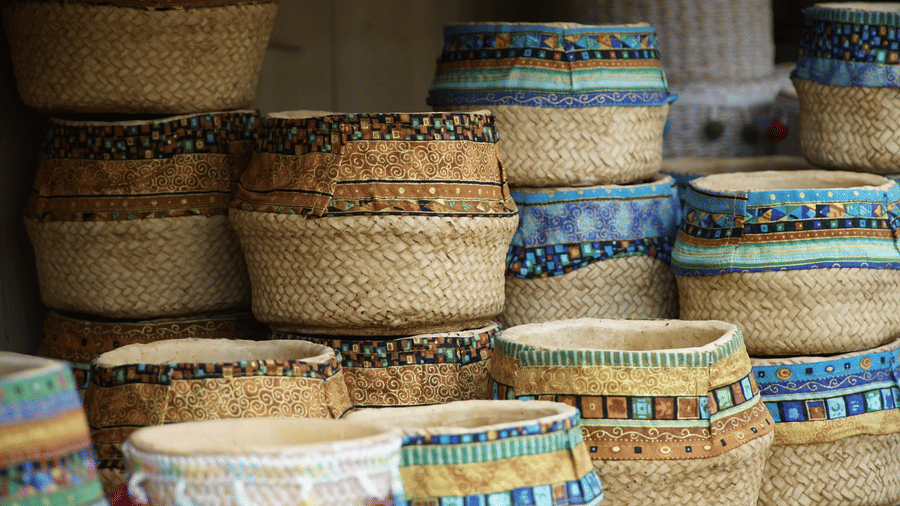 A close up of many wicker baskets kept on top of each other to be sold in Broadway Market, Kochi.