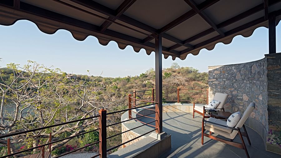 seats on the Balcony with view of the forest inside one of the rooms - Chunda Shikar Oudi
