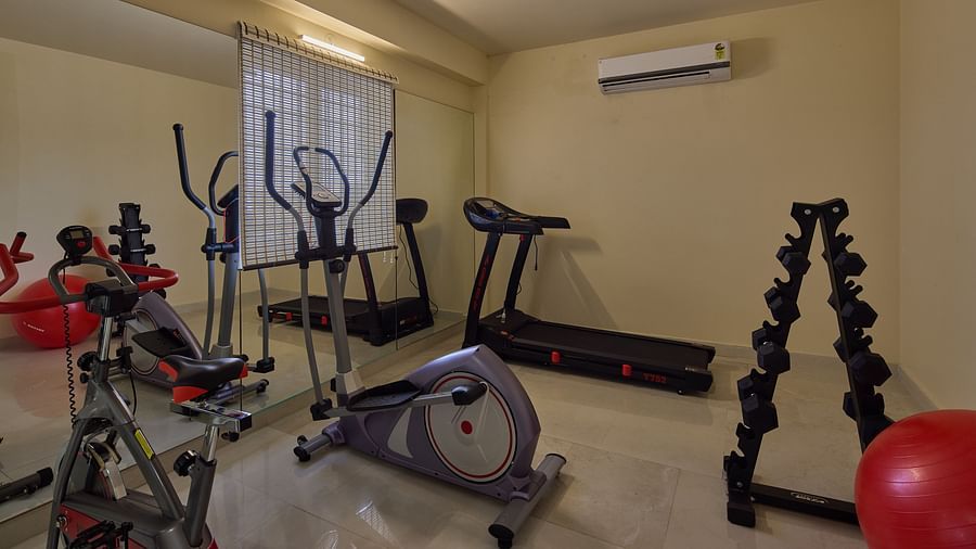 A treadmill, cycle and more inside the fitness centre at Grand Continent - A Sarovar Premiere Affiliate Hotel, Hosur