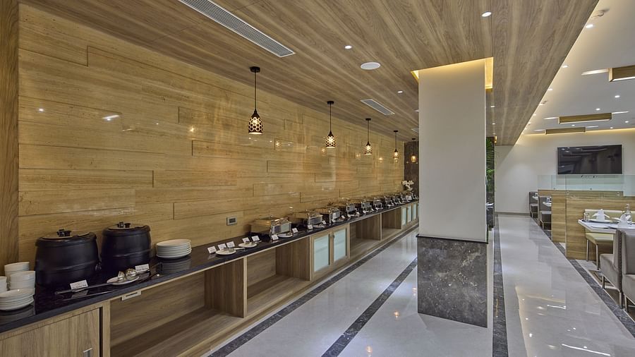 Buffet station in the restaurant at Grand Continent - A Sarovar Premiere Affiliate Hotel, Hosur