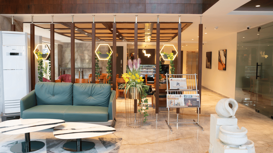 Elegant lounge space at Magnus Lxia Premier, Kalyani Nagar featuring comfortable seating and warm interiors.