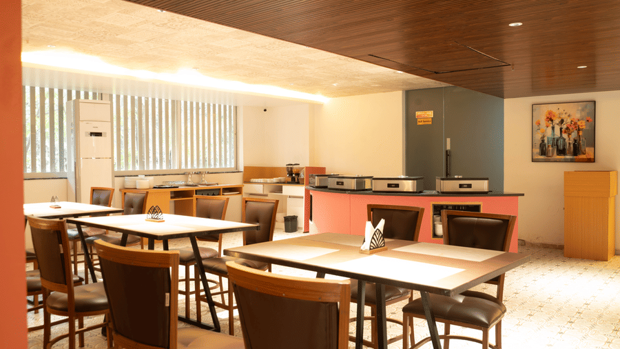 Restaurant seating at Magnus Lxia Premier, Kalyani Nagar with neatly arranged tables and modern interiors.
