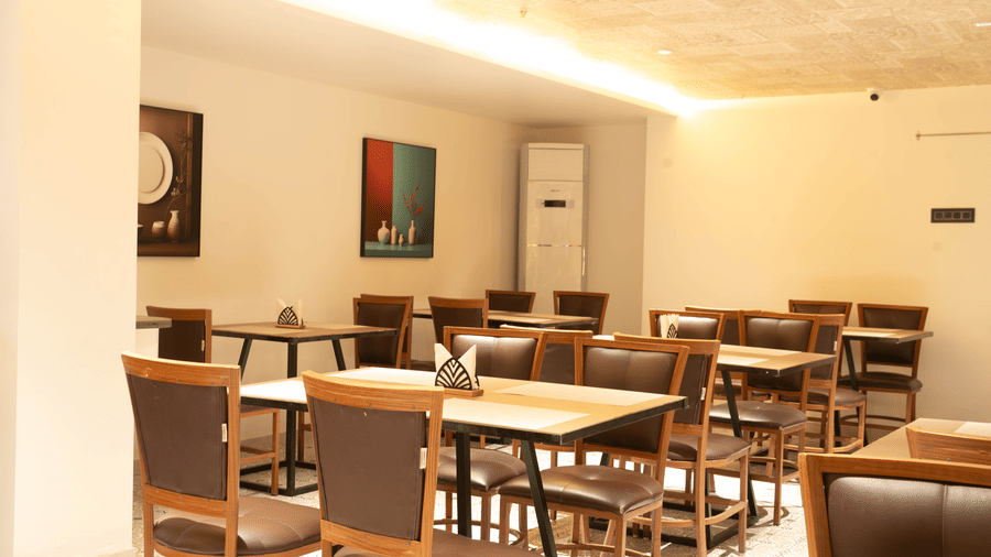 Dining area at Magnus Lxia Premier, Kalyani Nagar with comfortable seating and ambient lighting.