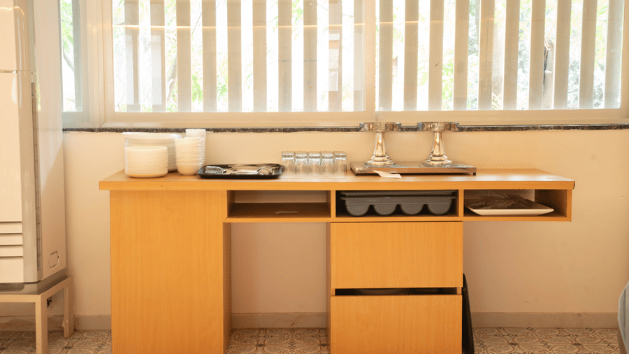 Kitchenette setup at Magnus Lxia Premier, Kalyani Nagar with basic appliances and functional design.