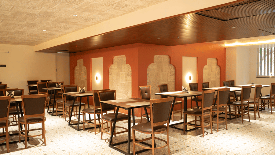 Spacious dining area at Magnus Lxia Premier, Kalyani Nagar with neatly arranged tables and warm interiors.