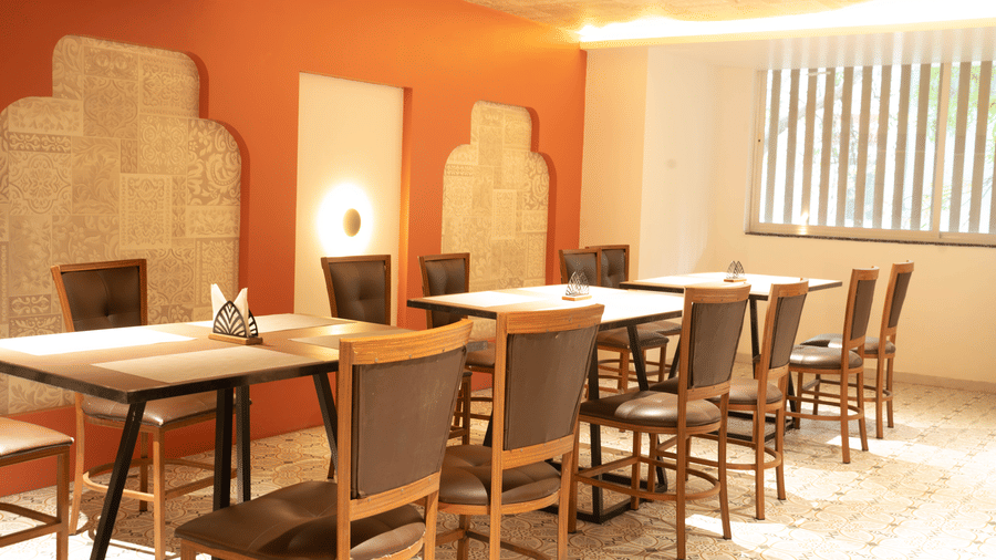 Restaurant seating at Magnus Lxia Premier, Kalyani Nagar with modern décor and comfortable dining setup.