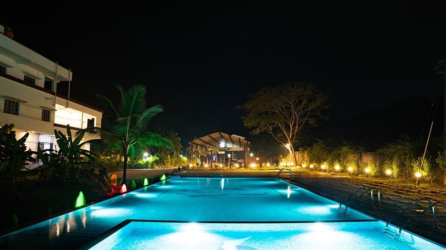 Another view of the swimming pool in the night with the lights on - Mastiff Select Terrain