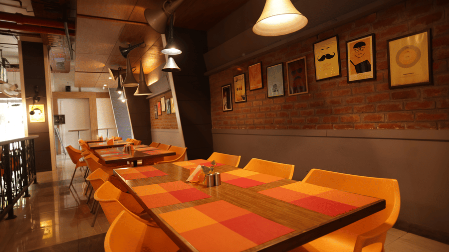 Vibrant Bollywood-inspired decor at Mumbai Masala restaurant in Jabalpur, creating a lively and fun dining atmosphere - Hotel Polo Towers Group