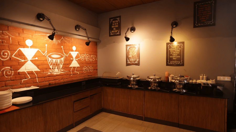 Mumbai Masala restaurant, features folklore inspired graffiti on the wall behind the buffet counter - Hotel Polo Towers Group