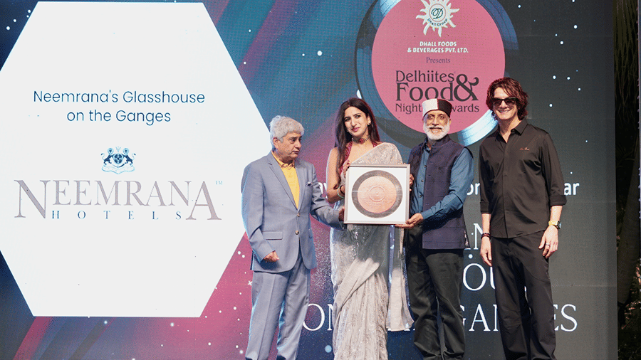 The Neemrana Hotels team receiving an award for 'Glasshouse on the Ganges' at the 2026 Delhiites Food & Nightlife Awards.