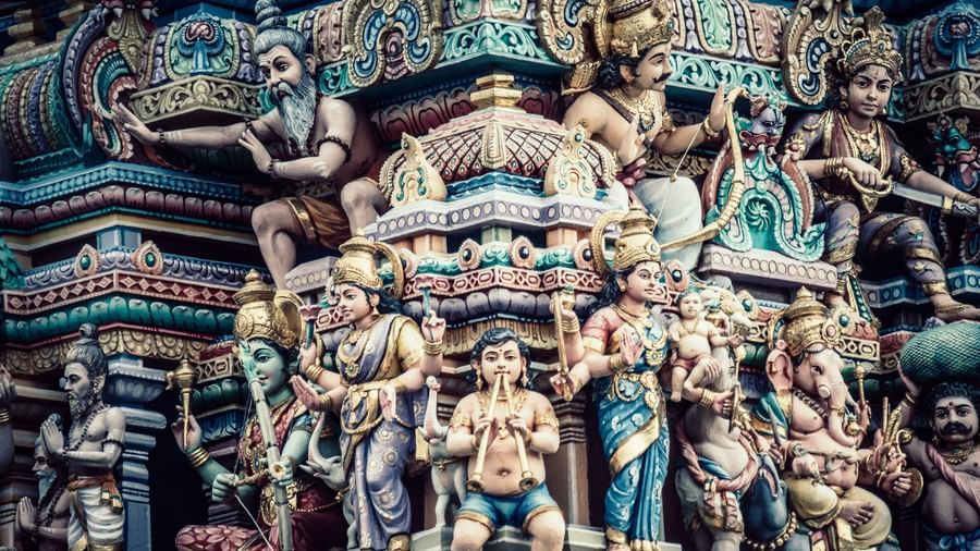 A close up image of many deities carved on the temple roof