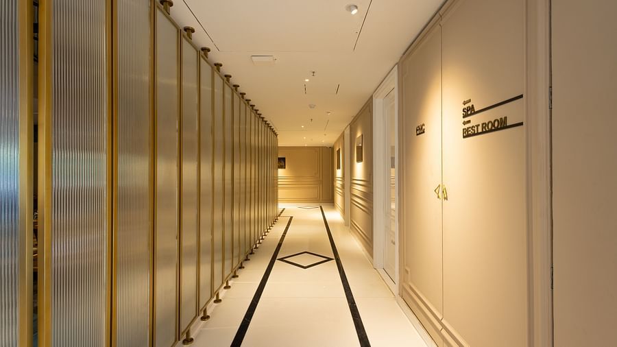 A corridor with golden lights | Renest Calangute, Goa