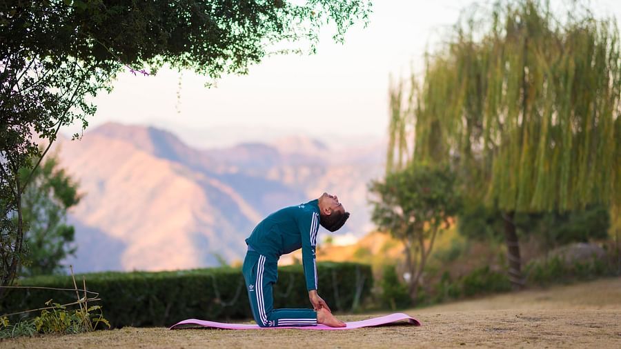 The Manor Shimla - A person doing yoga near The Manor