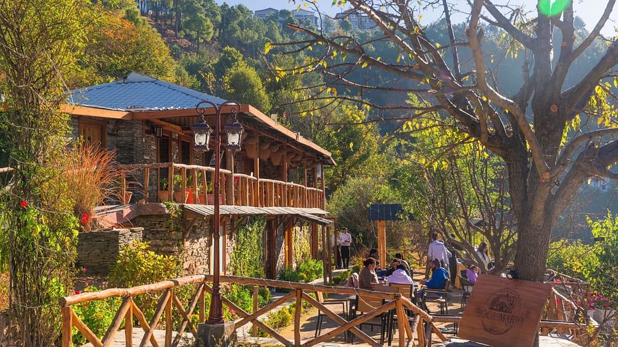 The Manor Shimla - People sitting at Boca Mario restaurant amidst the mountains
