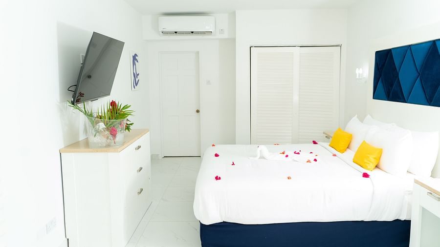 The Soco House - view of a bed facing the TV