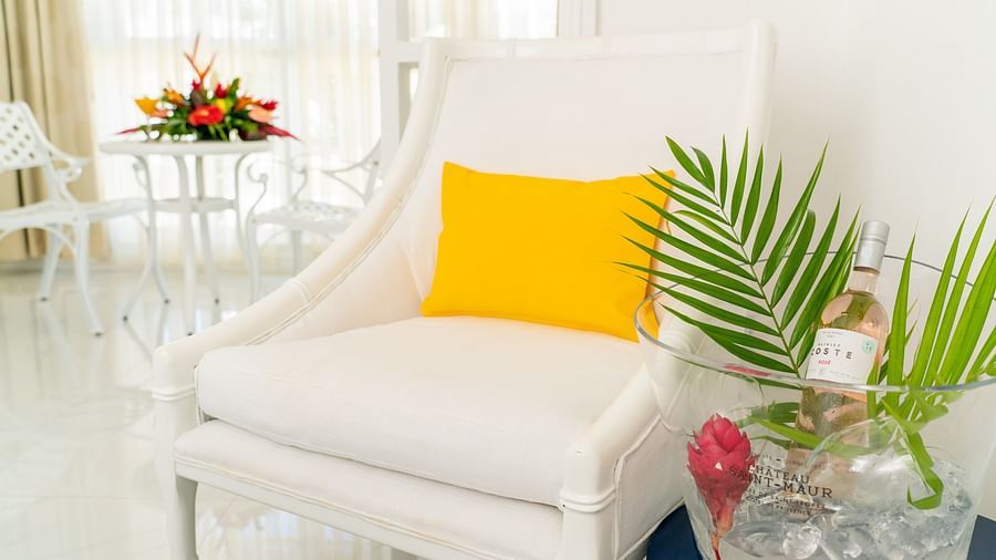 The Soco House - a sofa kept beside a table at one of the rooms in Saint Lucia