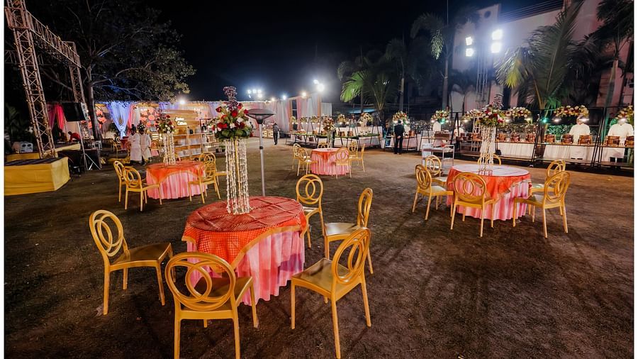 The table-chair arrangements in the outdoor venue - Wedlock Greens Hotel Resorts Dhanbad