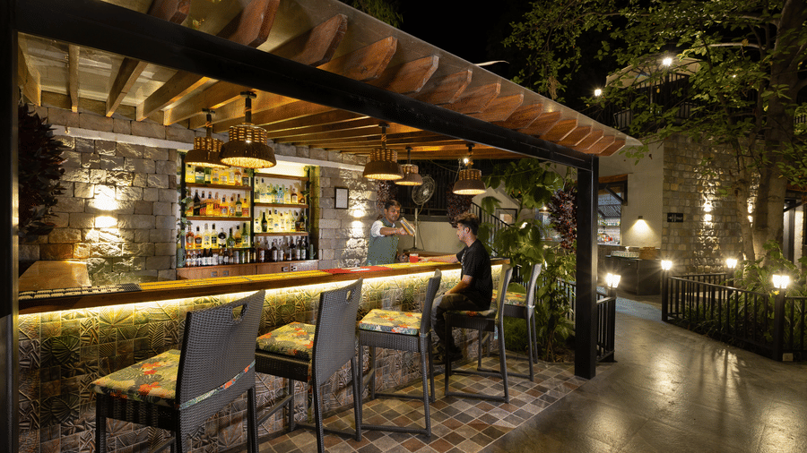 Jungle grill restaurant with refined decor and seating area at The Golden Tusk, Jim Corbett