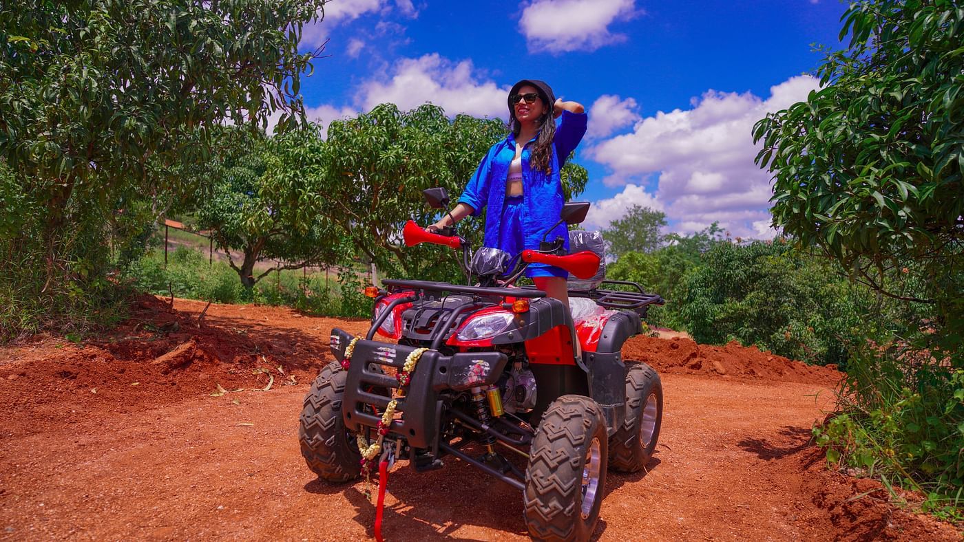 Ravishing Retreat Ramanagara - A guest standing on the ATV at our resort