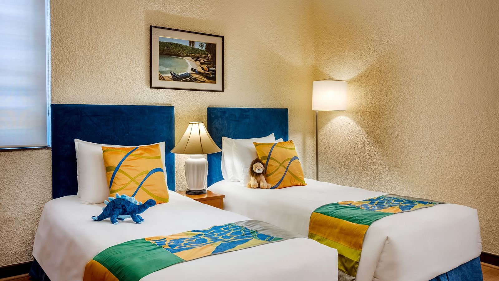 twin beds with colourful pillow and runner inside 2 Bedroom Garden Villa - Caravela Beach Resort Goa