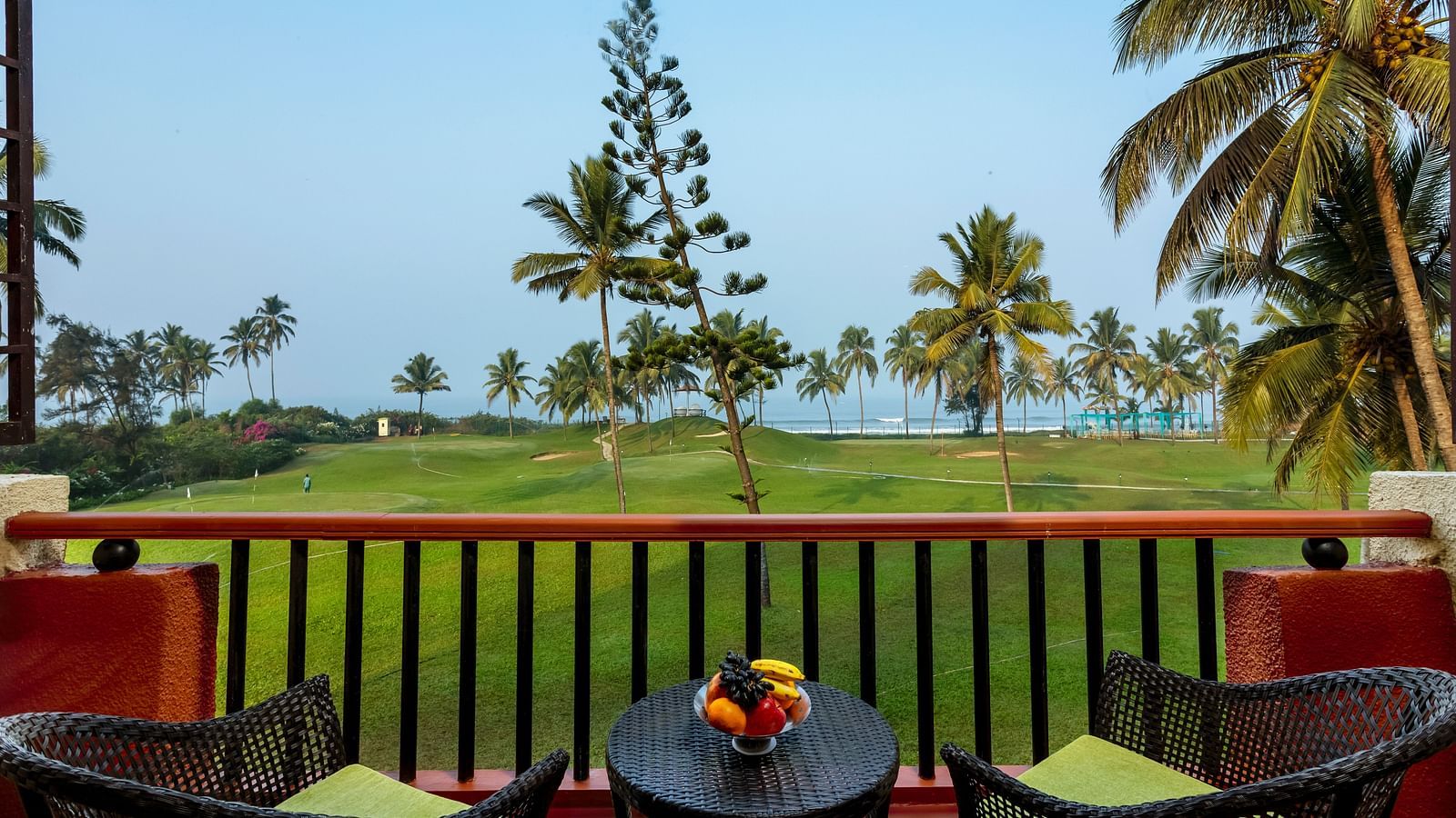 two chairs and a table in the balcony of Ocean front view - Caravela Beach Resort Goa