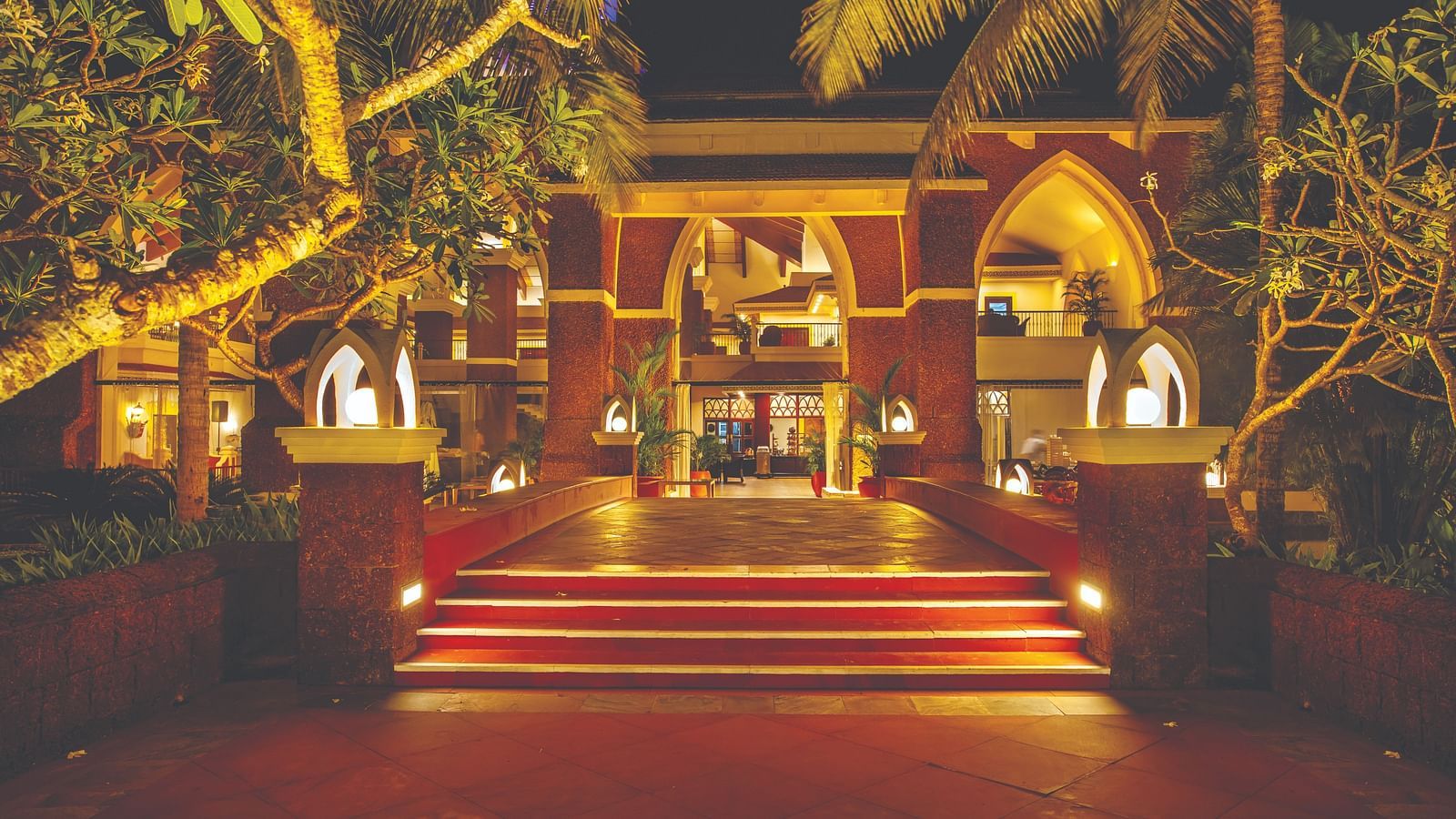 entrance to Caravela Beach Resort Goa in the night with the lights on 