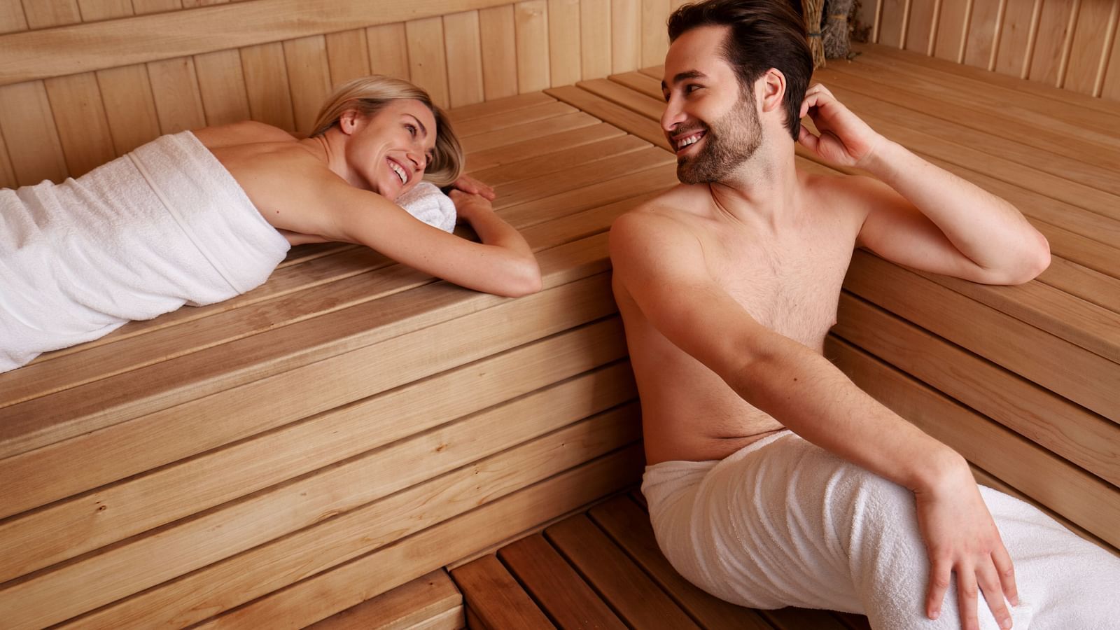 Couple relaxing together in a sauna cabin - Cedar Inn, Darjeeling