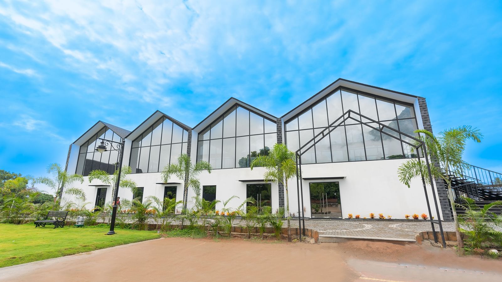front view image of the blue moon event space with with white coloured walls - Darza Resorts