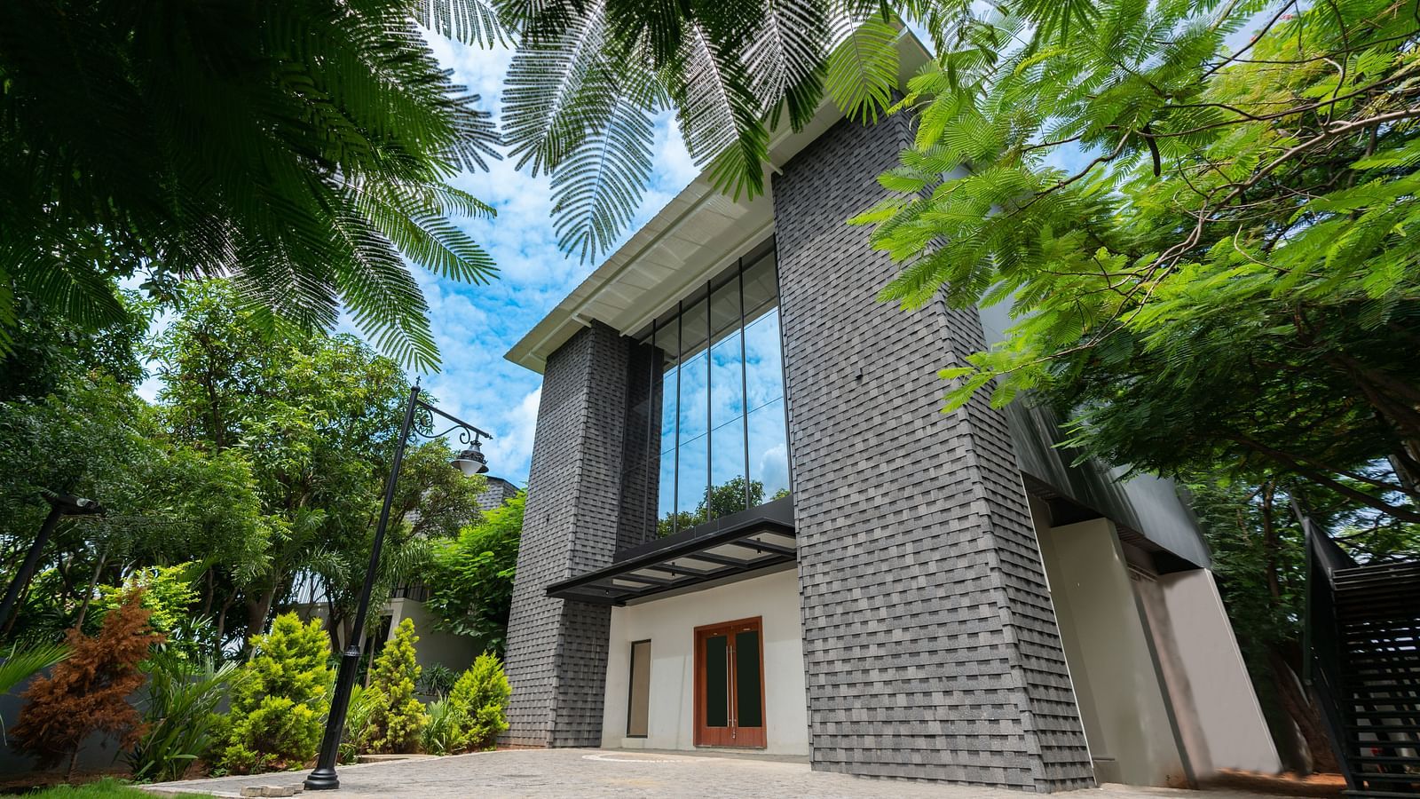 close up image of the royal affair taken from a lower angle situated amidst a canopy of trees - Darza Resorts