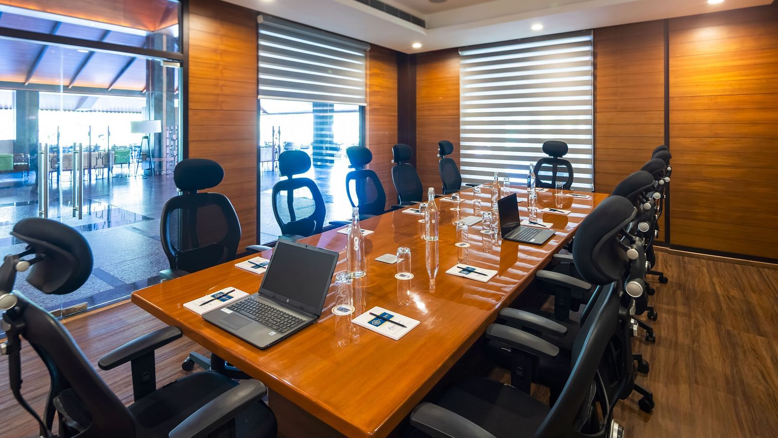 Gamyam Retreat, Kumta - Chairs arranged around the conference table in our board room and laptops and water bottles kept on the table