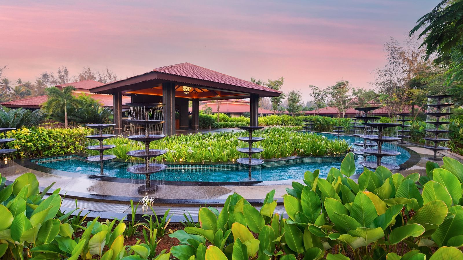An overview of the swimming pool with a canopy in between - Gamyam Resort