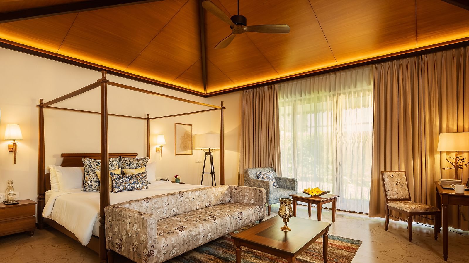 A double bed with side tables and lamps inside Cluster Villa - Gamyam retreat