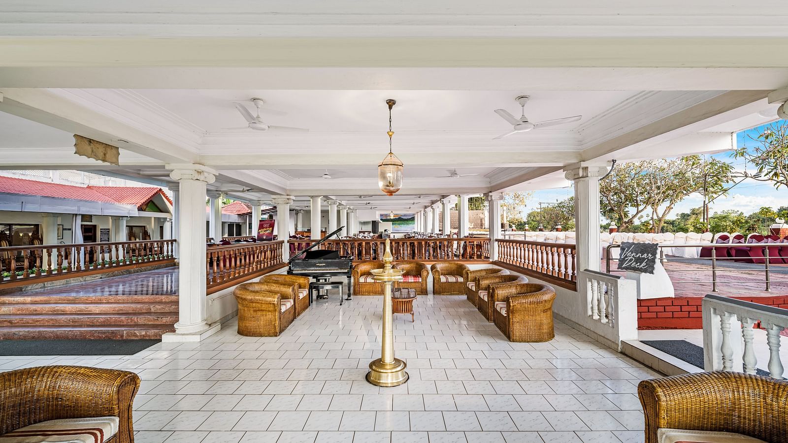 An image of the waiting area with sofa set and table with decoration - GReaT Trails River View Resort Thanjavur By GRT Hotels