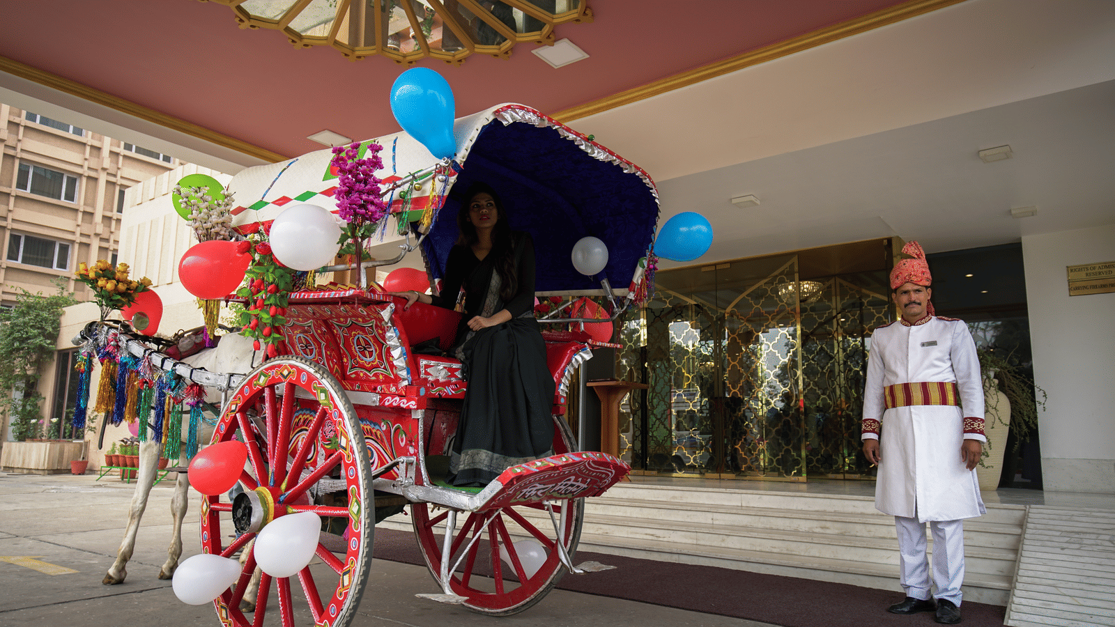 A horse-carriage parked outside the entrance of Hotel Clarks Shiraz, Agra