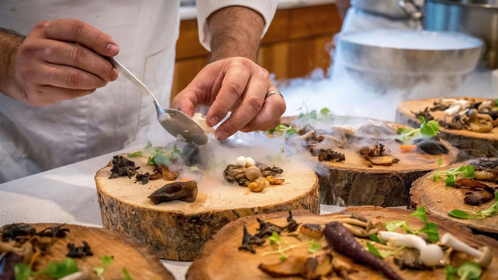 A chef serving the dish
