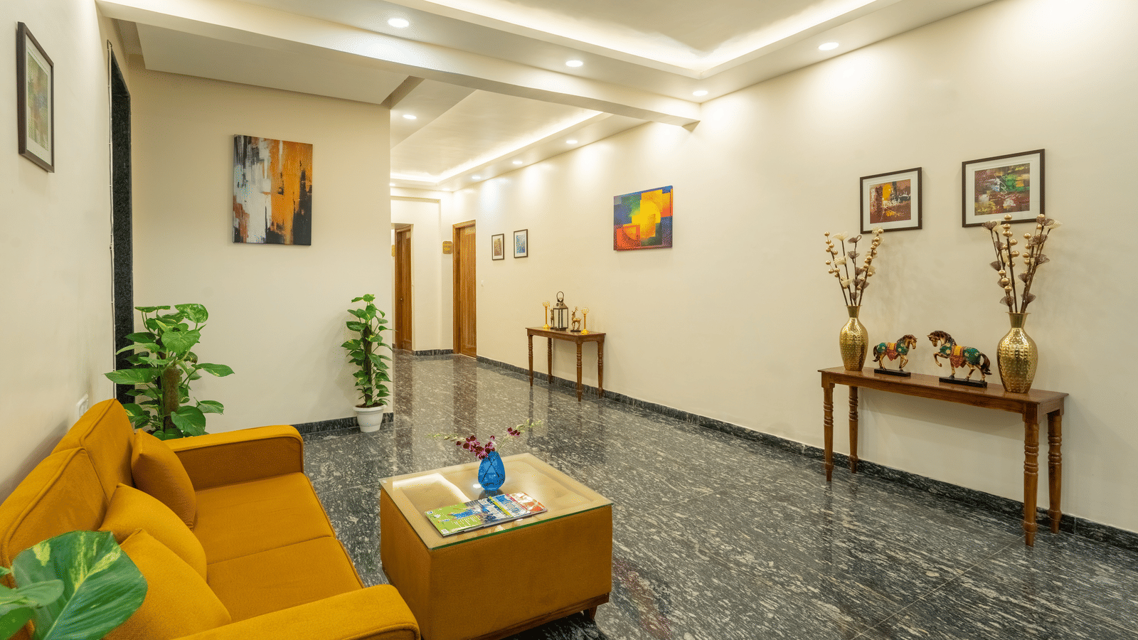 Spacious hotel lobby with a seating area and modern interiors.
