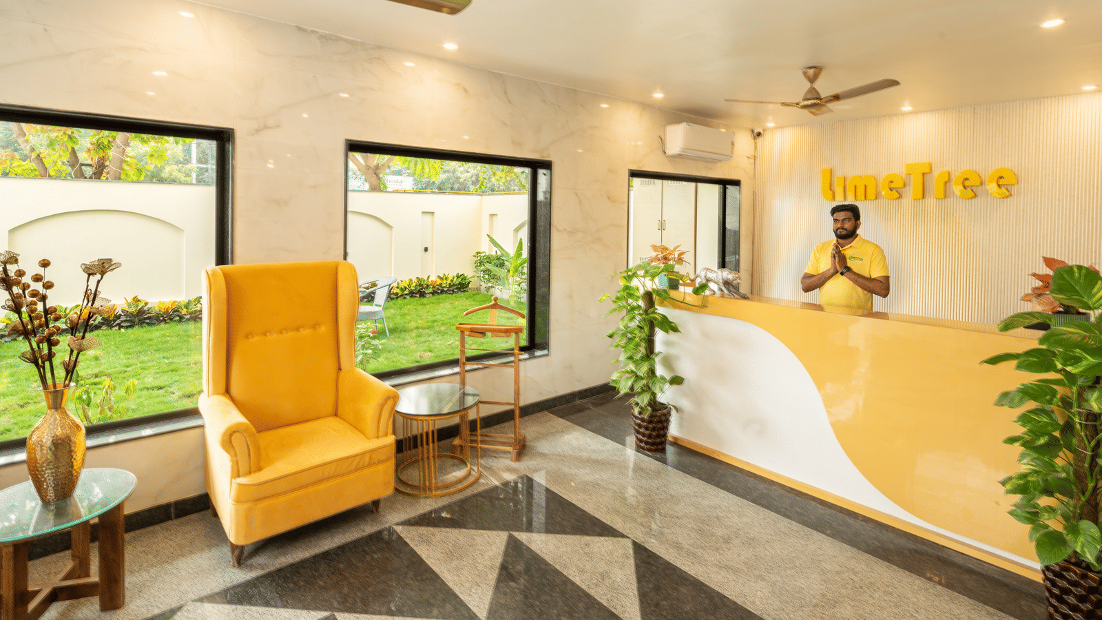 Hotel reception area with stylish seating and a welcoming front desk.