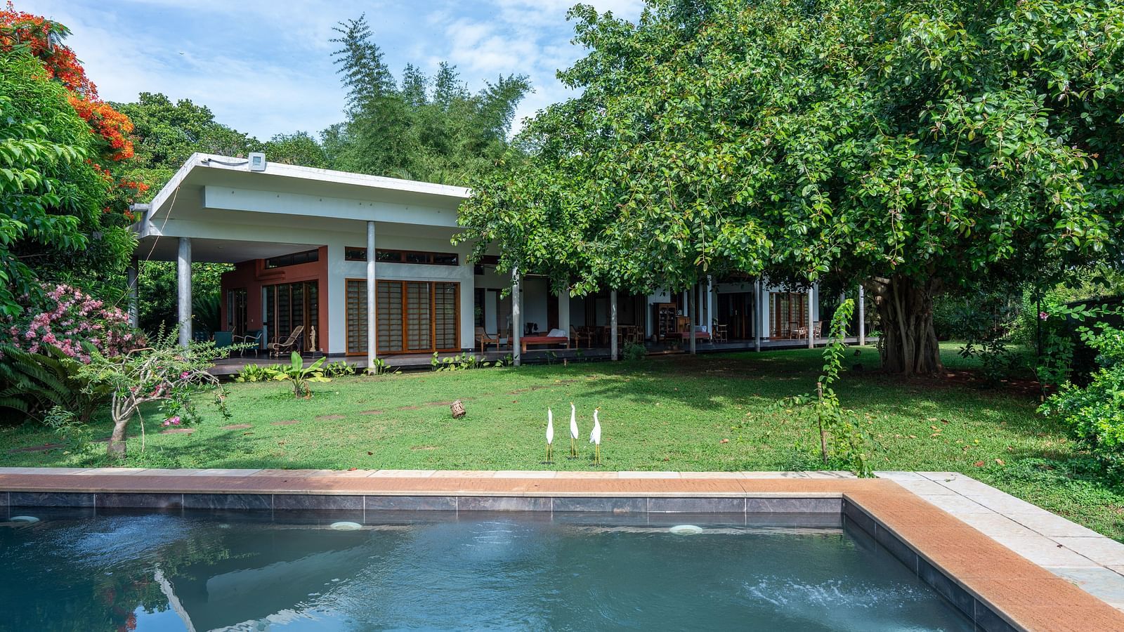 Villa Lawn- Comfortable seating in the sit-out area, overlooking the private pool and garden.