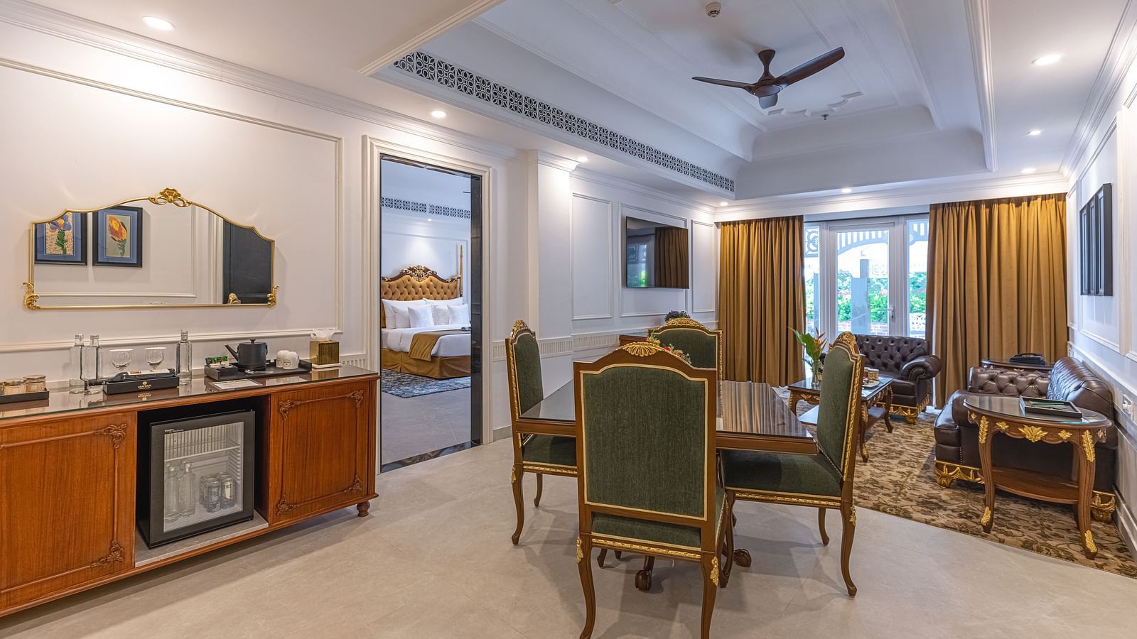 Elegant suite with dining area and classic furnishings at MAYFAIR Palm Beach Resort, Gopalpur-on-Sea