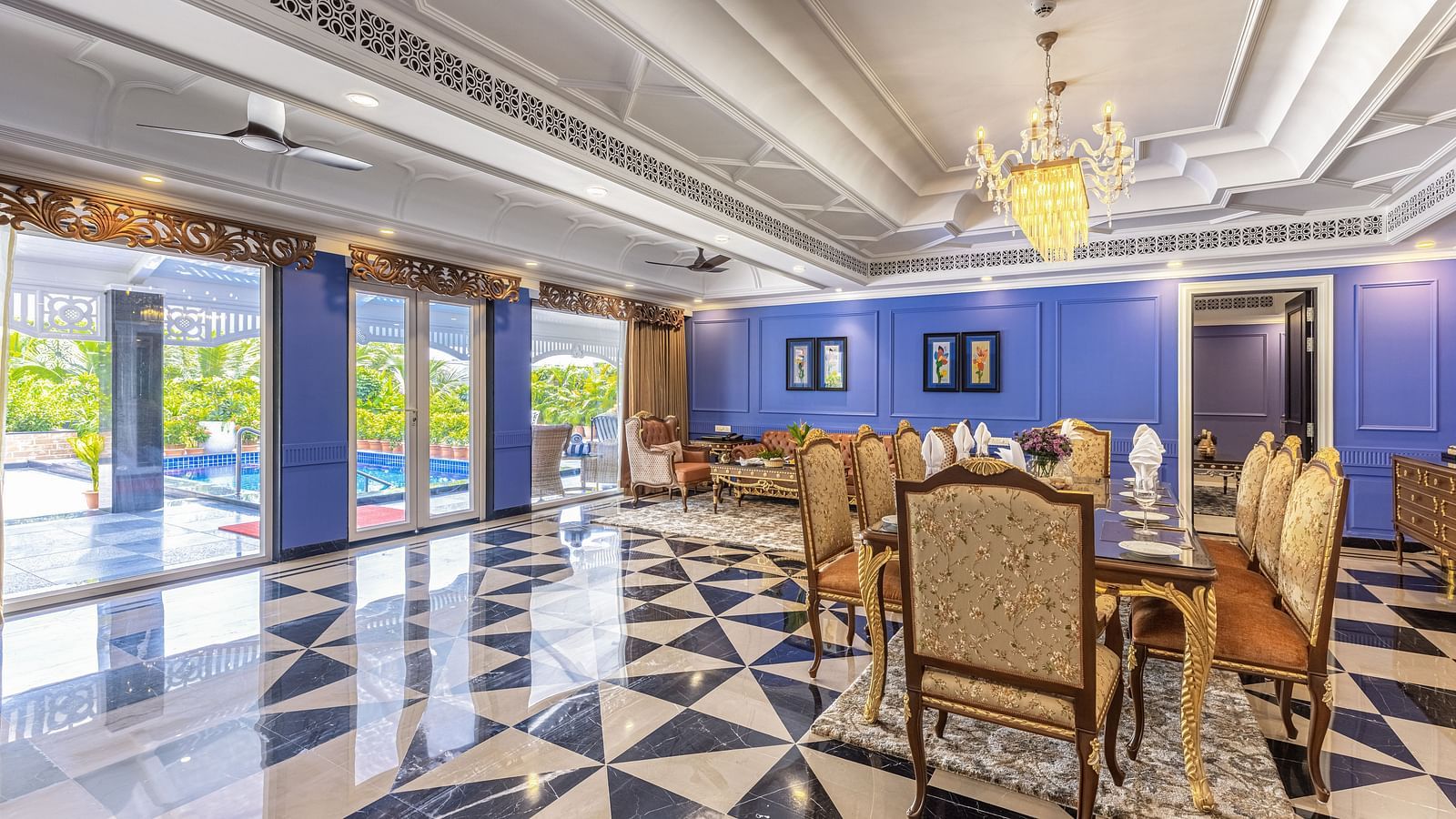 Living area with dining area and large windows opening to the pool area at MAYFAIR Palm Beach Resort, Gopalpur-On-Sea 
