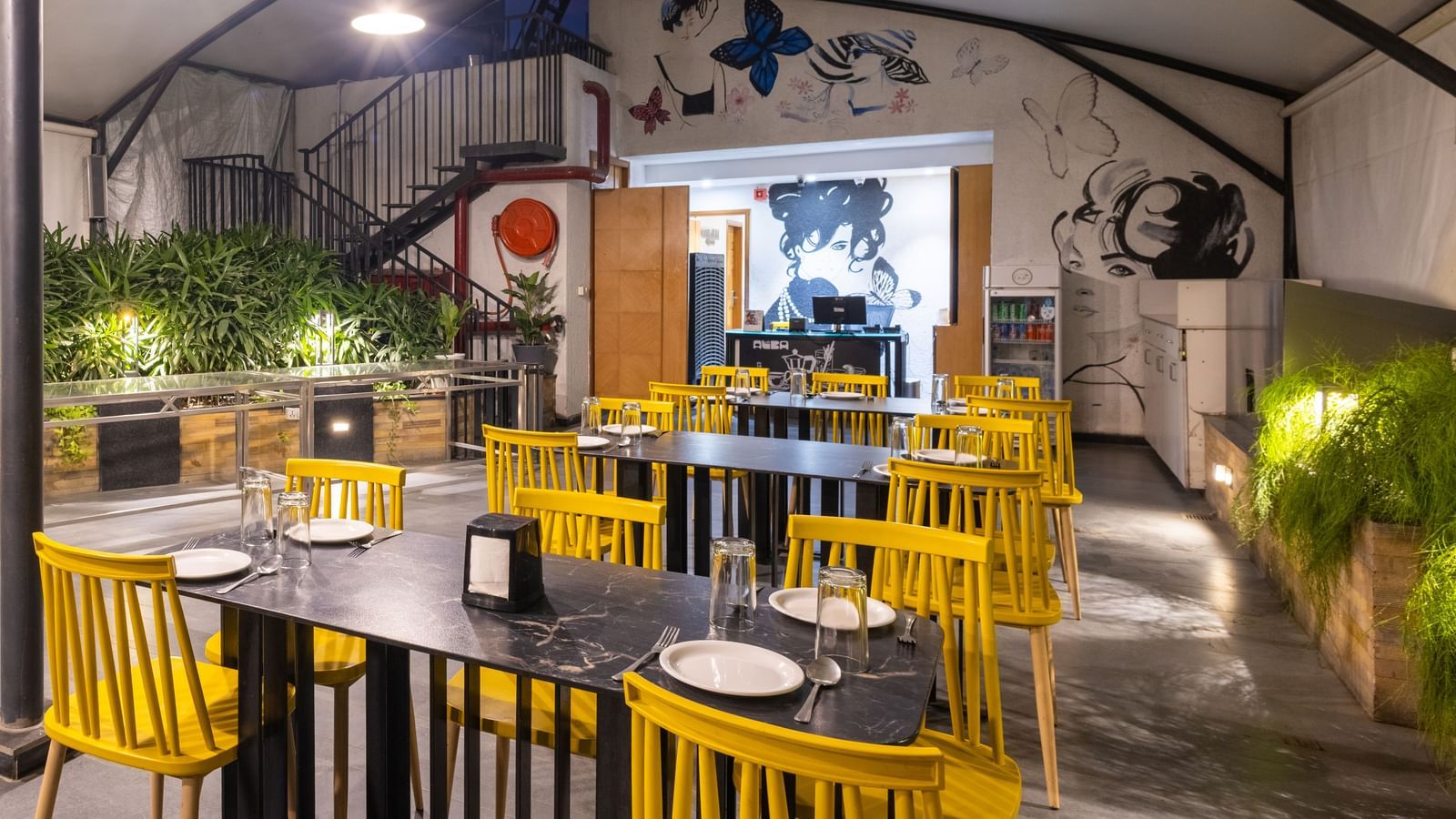 Rooftop dining setup in the Pravasa Cafe at Pravasa Stay Vijay Nagar, Indore.