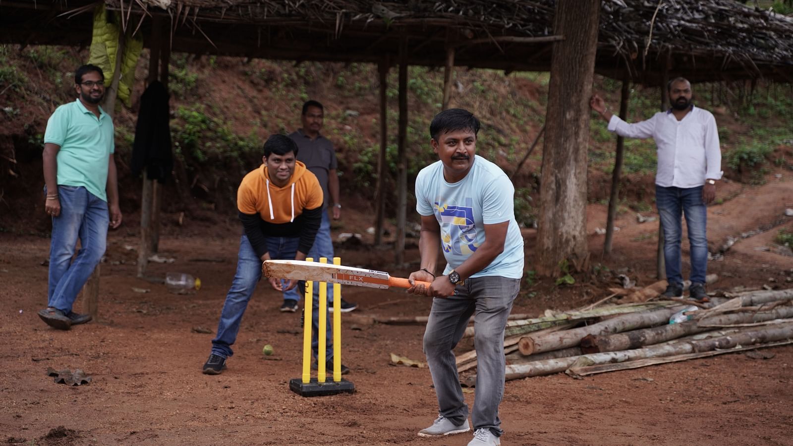 A group of people at Ravishing Retreat playing cricket 