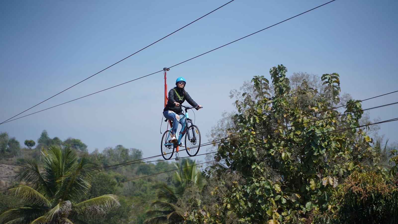 A guest zip cycling at Ravishing Retreat on a sunny day