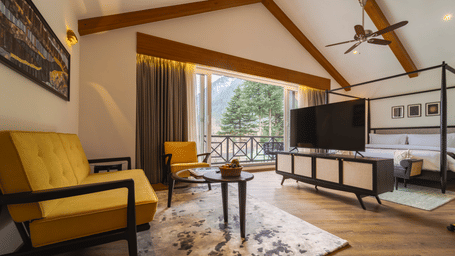 Spacious suite with mountain views and elegant interiors at Nivasana Manali.