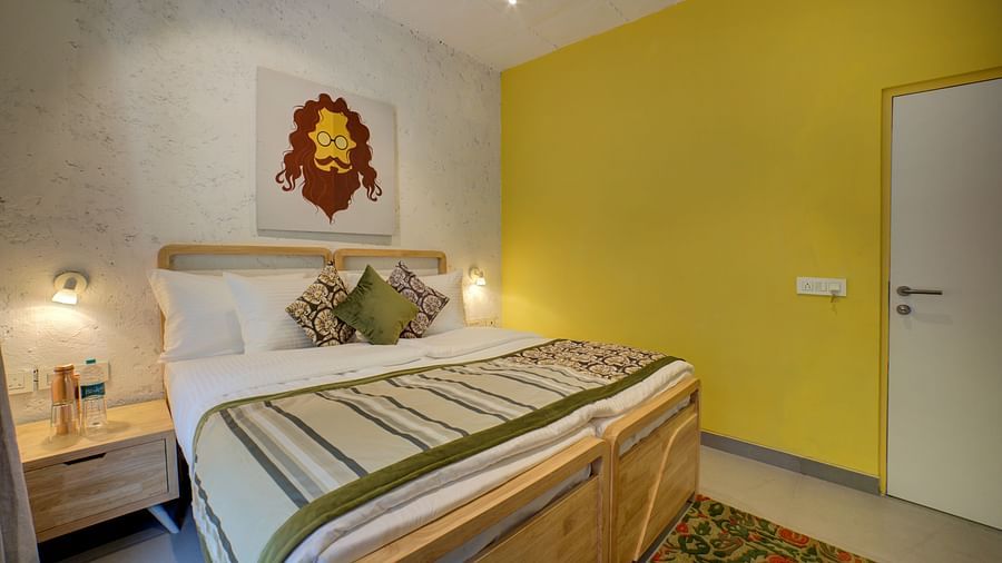 A bedroom a large bed with side lamps - Bedzzz, Rishikesh